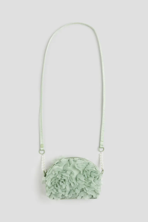 Fabric flower-covered shoulder bag